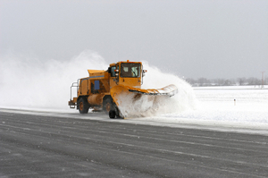 Snowplough working through the weather disruption at Heathrow